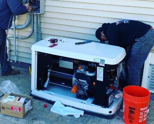 man installing generator